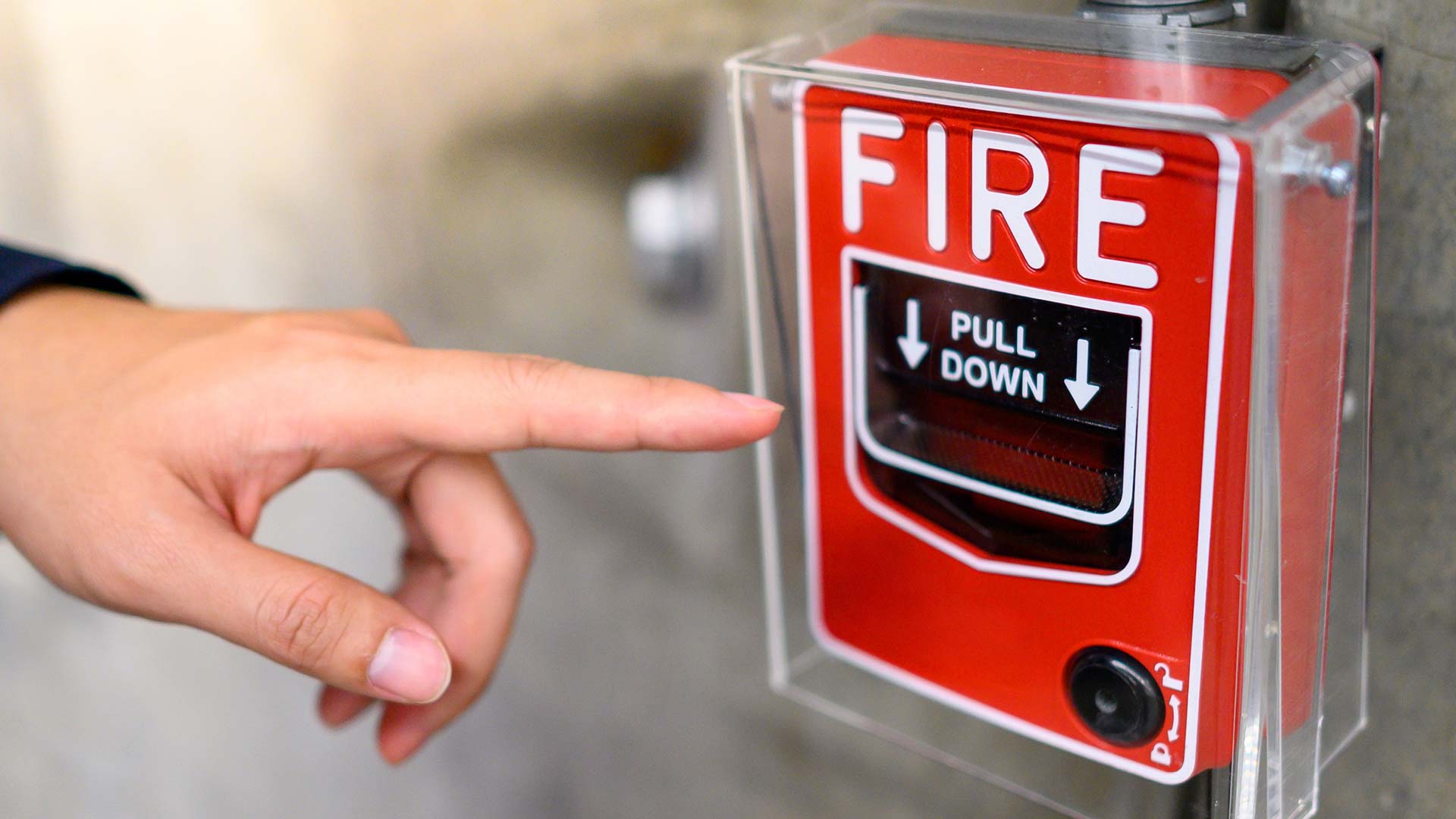 pointing-at-fire-alarm